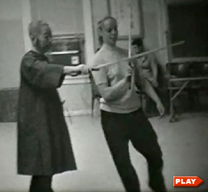 Cheng Man Ching fencing with young woman