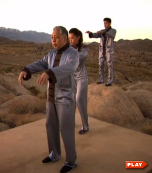 William Chen, Max Chen, and Tiffany Chen doing the Tai Chi form in the desert