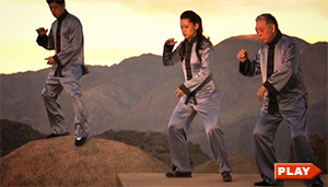 William Chen, Max Chen, and Tiffany Chen doing the Tai Chi form in the desert