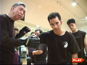 William Chen instructing Max Chen on the right-cross punch