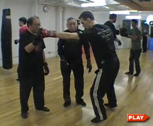 William Chen instructing Jordan F. and Eddy on how to jab
