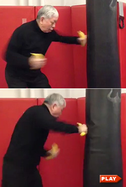 William Chen punching a bag while holding a banana in each hand