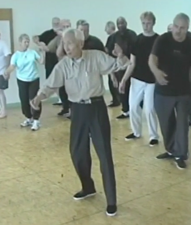 Dr. Tao leads class in push hands warm-up exercises